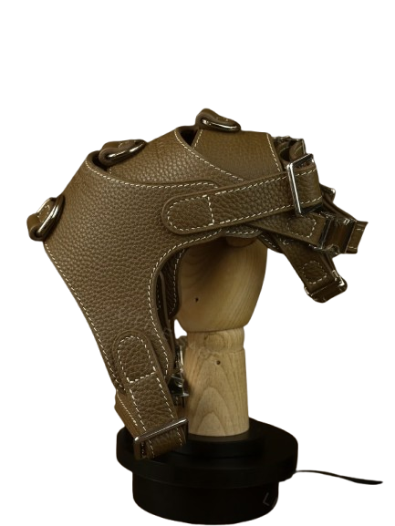 Luxury Leather Pet Harness displayed on a wooden stand, showcasing its premium craftsmanship and sleek design.